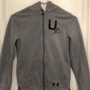 A grey gently use under armor boys jacket